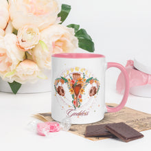 Load image into Gallery viewer, 11 oz. white ceramic coffee/tea mug with solid light pink handle, rim, and inside. Image Design: Female reproductive organ, vagina, uterus, ovaries, with leaves and flowers, moon phases above. Right hand side view.