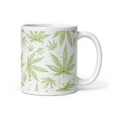 Load image into Gallery viewer, 11 oz. White glossy ceramic coffee/tea mug. Image Design: Green marijuana leaves with gold edges and classy dots, wrapped around print. Right hand side view.