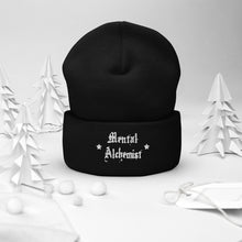 Load image into Gallery viewer, cuffed beanie black, with image phrase &quot;Mental Alchemist.&quot; background: winter themed, Christmas gifts.
