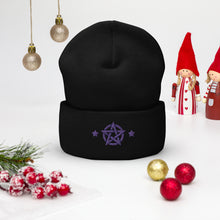 Load image into Gallery viewer, cuffed beanie black, with image design of purple pentacle and stars. background: winter themed, Christmas gifts.
