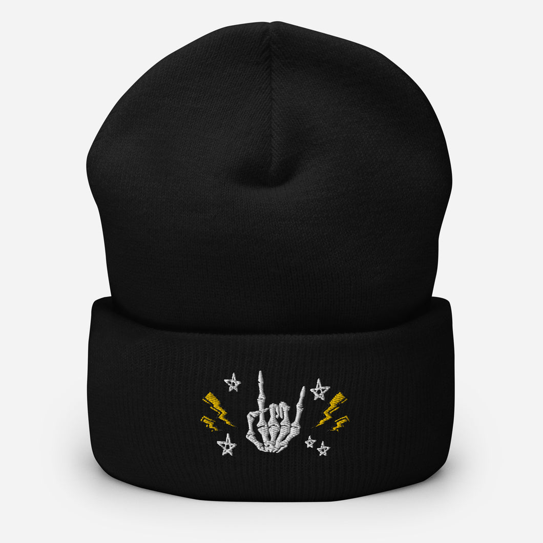 cuffed beanie black, with image design of rock on skeleton hand, pentagram stars, lightning symbols. background: winter themed, Christmas gifts.