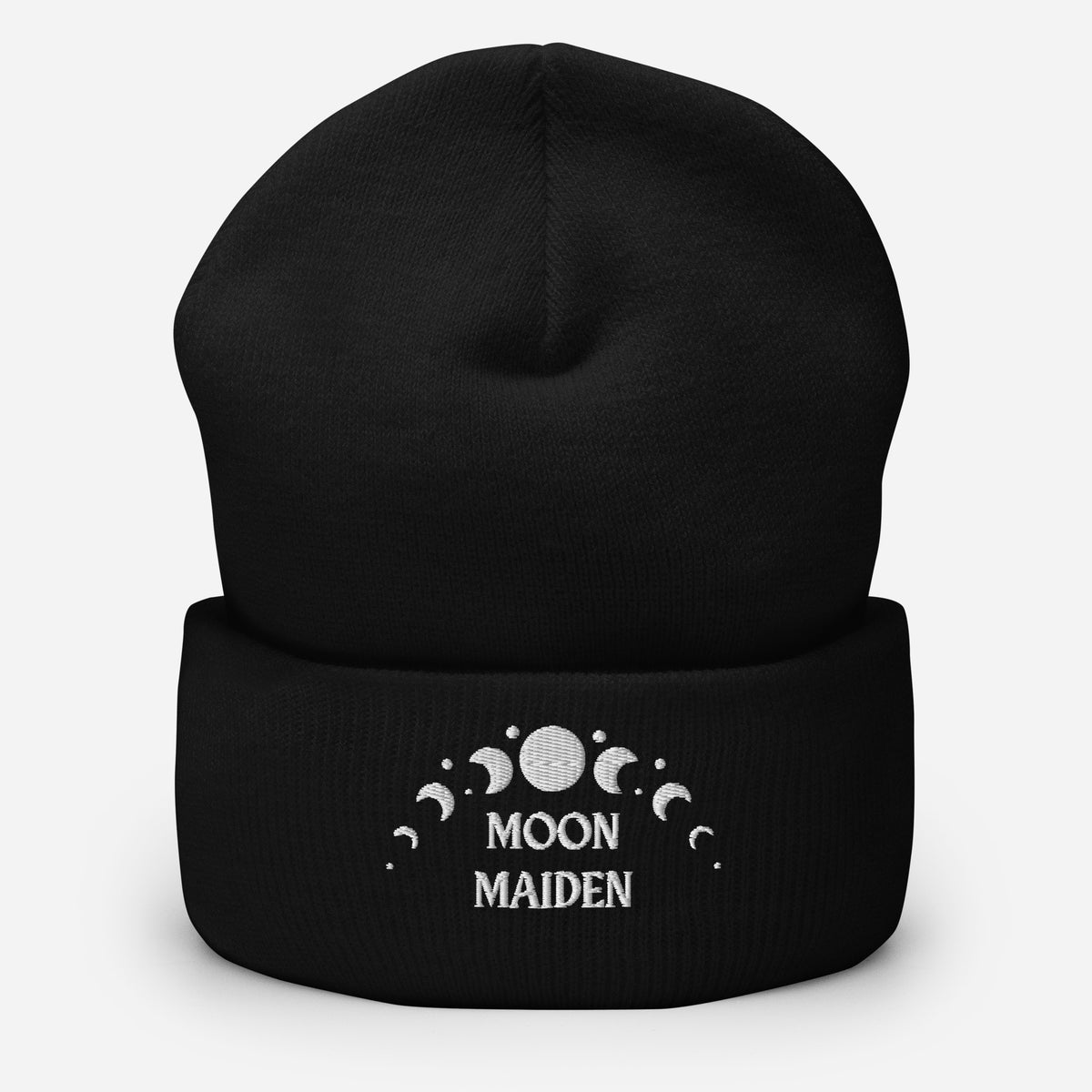 cuffed beanie black, with image phrase "Moon Maiden," and image graphic of moon phases. background: winter themed, Christmas gifts.