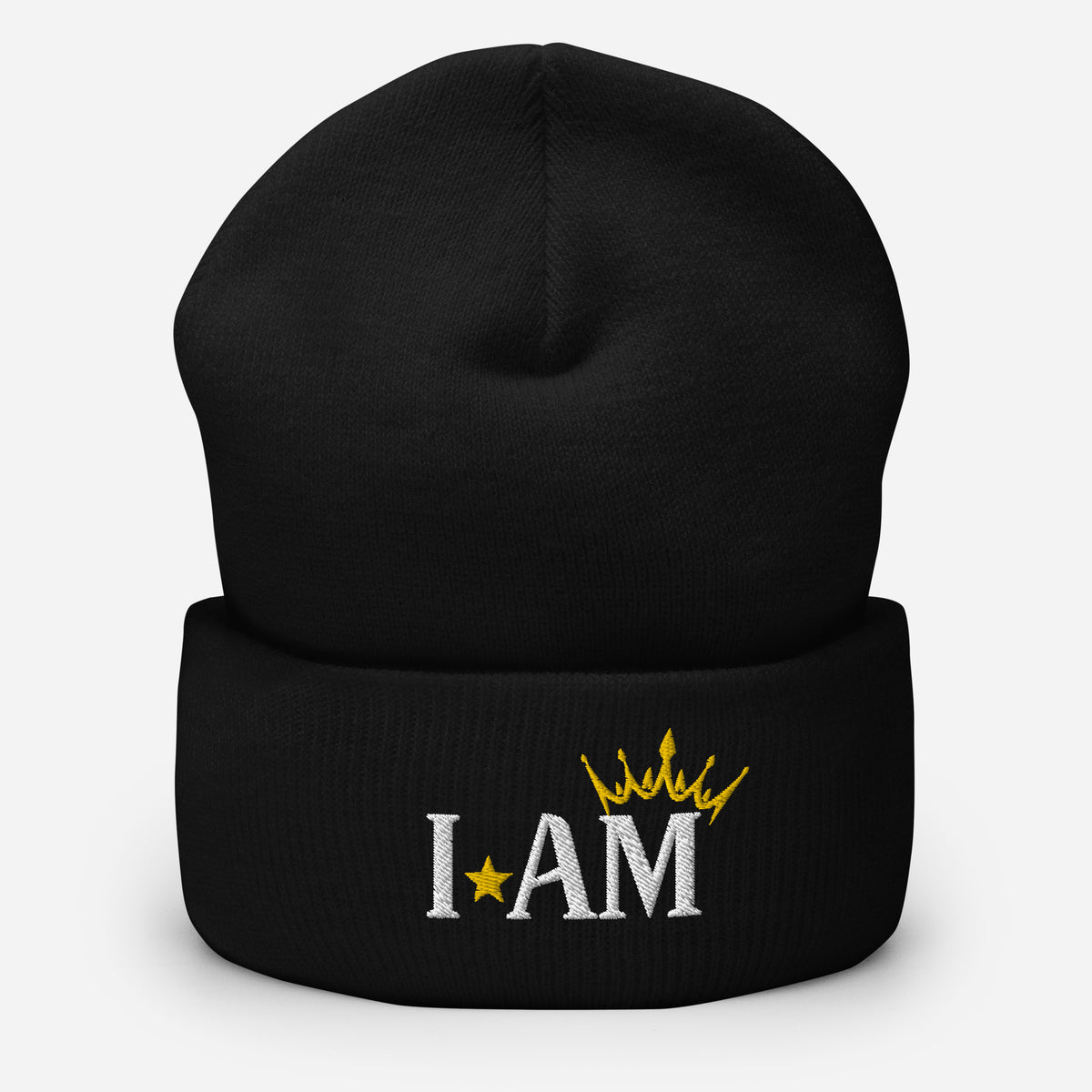 cuffed beanie black, with image phrase "I AM," with image of a crown over the word AM. background: winter themed, Christmas gifts.