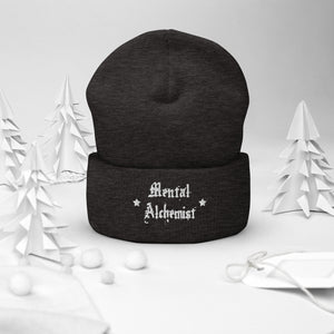 cuffed beanie dark grey, with image phrase "Mental Alchemist." background: winter themed, Christmas gifts.