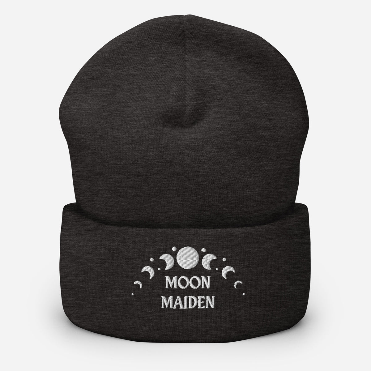 cuffed beanie dark grey, with image phrase "Moon Maiden," and image graphic of moon phases. background: winter themed, Christmas gifts.