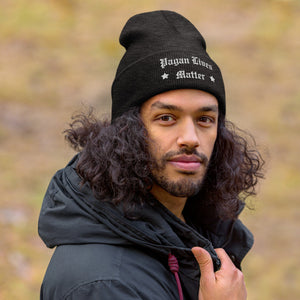 man wearing cuffed beanie dark grey, with image phrase "Pagan Lives Matter."  winter , Christmas gifts.