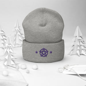 cuffed beanie heather grey, with image design of purple pentacle and stars. background: winter themed, Christmas gifts.