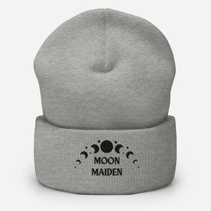 cuffed beanie heather grey, with image phrase "Moon Maiden," and image graphic of moon phases. background: winter themed, Christmas gifts.