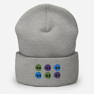 beanie heather grey, with image design of 6 purple, green, and blue skulls, 2 of each color, in two rows.  Front view.