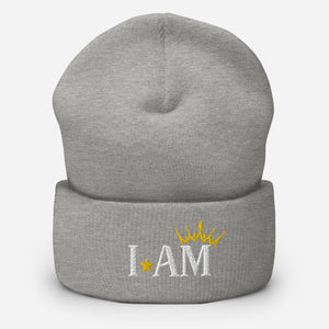 cuffed beanie heather grey, with image phrase "I AM," with image of a crown over the word AM. background: winter themed, Christmas gifts.