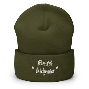 cuffed beanie olive green, with image phrase "Mental Alchemist." background: winter themed, Christmas gifts.