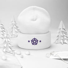 Load image into Gallery viewer, cuffed beanie white, with image design of purple pentacle and stars. background: winter themed, Christmas gifts.
