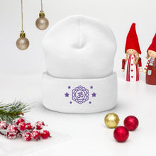 Load image into Gallery viewer, cuffed beanie white, with image design of purple third eye chakra symbol, with purple stars. background: winter themed, Christmas gifts.
