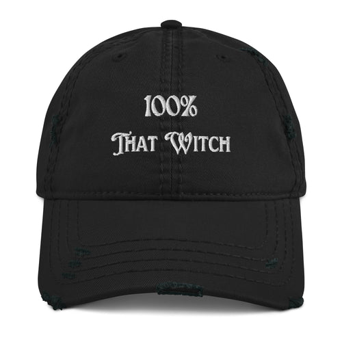 Black distressed hat. Baseball cap. Phrase: 100% That Witch. Featuring bold embroidered white lettering on the front, playful and stylish. Front side center view.