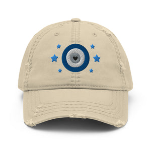 distressed hat cap khaki, with image graphic of blue eye of protection/evil eye/third eye, and stars. Front view.