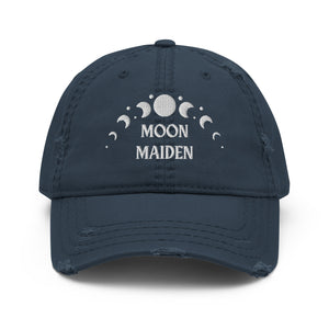 distressed baseball cap navy blue, with image phrase "Moon Maiden," and image graphic of moon phases. background:  Christmas gifts.