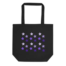 Load image into Gallery viewer, black tote bag, certified organic, features rows of purple stars, with each row darker than the one above it, creating a striking gradient effect. 4 shades of purple. 
