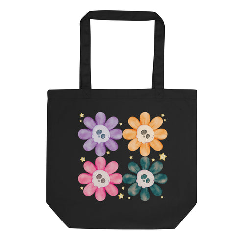 Black tote bag, certified organic, watercolor daisies with skull faces at their centers, mix of cute and creepy-cute, purple daisy, orange daisy, fuchsia pink daisy, black daisy.  adorned with cute yellow stars.