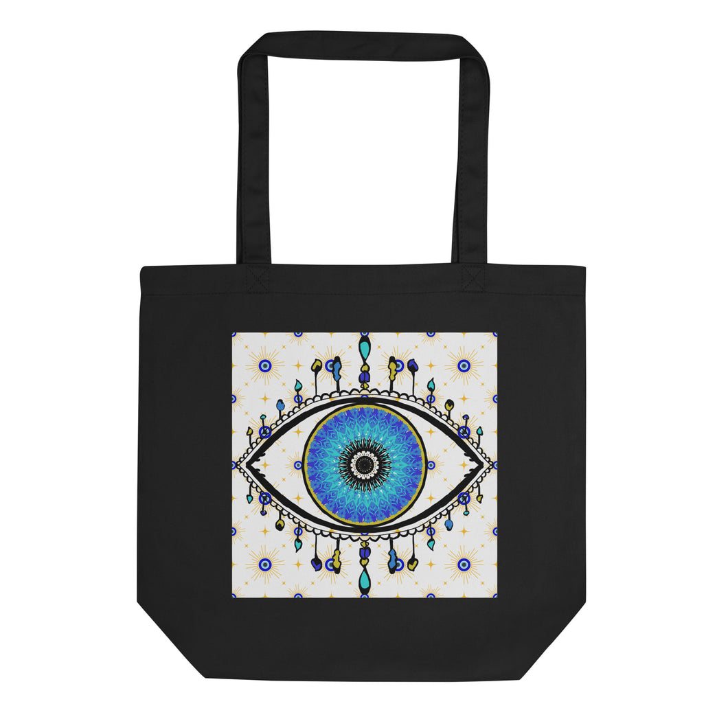 black colored tote bag with image of eye of protection/evil eye, colors of golden yellow, blue, light blue, third eye, eye, celestial stars. certified organic, cotton.