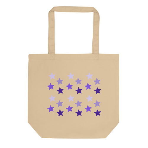 oyster colored tote bag, certified organic, features rows of purple stars, with each row darker than the one above it, creating a striking gradient effect. 4 shades of purple.