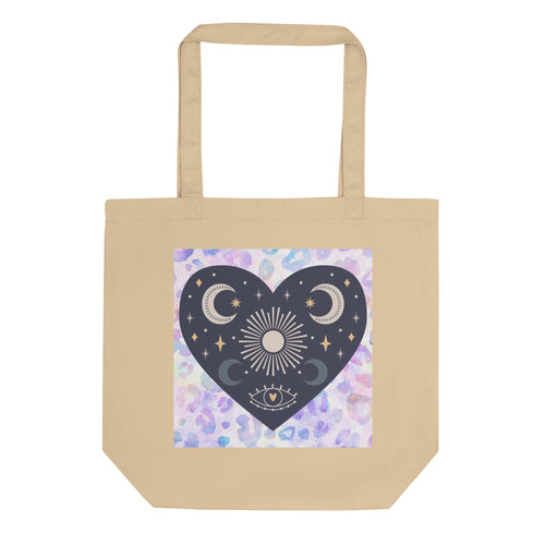 oyster colored tote bag, certified organic. Image design: blue mystical heart with eye in middle, and crescent moons, and a light purple leopard print background behind the image