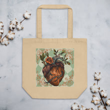 Load image into Gallery viewer, oyster colored tote bag, cotton, certified organic. Image design: Red illustrated heart with vines and rose, wavy green checkered print background  behind the image
