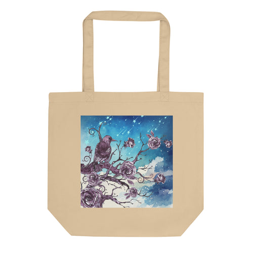 oyster colored tote bag, certified organic. Image design: Design: Watercolor raven and roses, with a light blue and white watercolor background and shooting stars print behind the image