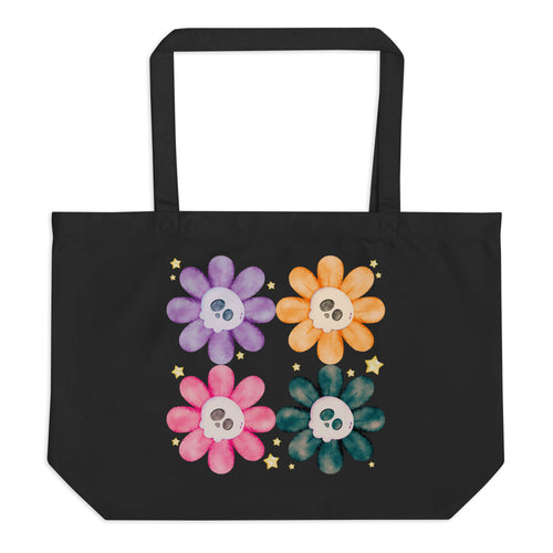 Large Black tote bag, certified organic, watercolor daisies with skull faces at their centers, mix of cute and creepy-cute, purple daisy, orange daisy, fuchsia pink daisy, black daisy.  adorned with cute yellow stars.