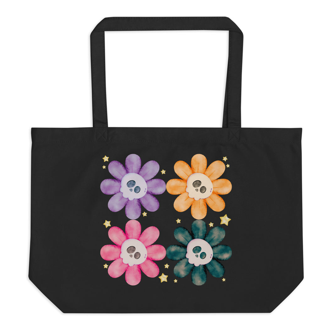 Large Black tote bag, certified organic, watercolor daisies with skull faces at their centers, mix of cute and creepy-cute, purple daisy, orange daisy, fuchsia pink daisy, black daisy.  adorned with cute yellow stars.