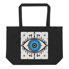 Load image into Gallery viewer, large black colored tote bag with image of eye of protection/evil eye, colors of golden yellow, blue, light blue, third eye, eye, celestial stars. certified organic, cotton.
