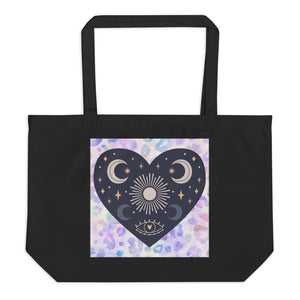 large black tote bag, certified organic. Image design: blue mystical heart with eye in middle, and crescent moons, and a light purple leopard print background behind the image