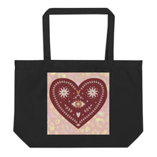 Load image into Gallery viewer, large black tote bag, certified organic. Image design: boho warm red mystical heart with eye in middle, and daisies, and a light red-gold leopard print background behind the image
