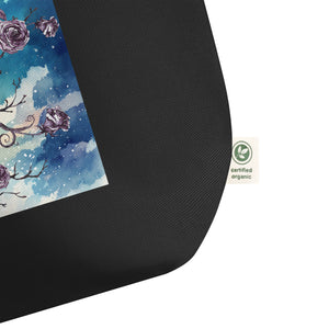 close up of tag, showing certified organic, Large black tote bag, certified organic. Image design: Design: Watercolor raven and roses, with a light blue and white watercolor background and shooting stars print behind the image