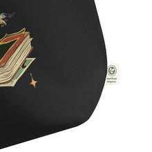 Load image into Gallery viewer, close up image of tag showing as certified organic, Large black tote bag, cotton, certified organic, with Image Design: Old book, vial, mushroom, and butterfly with a vintage look
