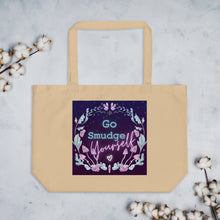 Load image into Gallery viewer, large oyster beige tote bag, certified organic, tote bag. Image design: whimsical mushrooms with eyes, crystals, with text, &quot;Go smudge yourself.&quot;
