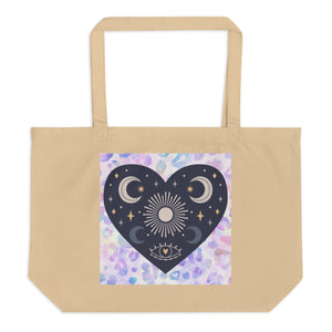 large oyster colored tote bag, certified organic. Image design: blue mystical heart with eye in middle, and crescent moons, and a light purple leopard print background behind the image