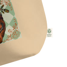 Load image into Gallery viewer, close up of tag, showing certified organic, large oyster colored tote bag, certified organic. Image design: Red illustrated heart with vines and rose, wavy green checkered print background  behind the image
