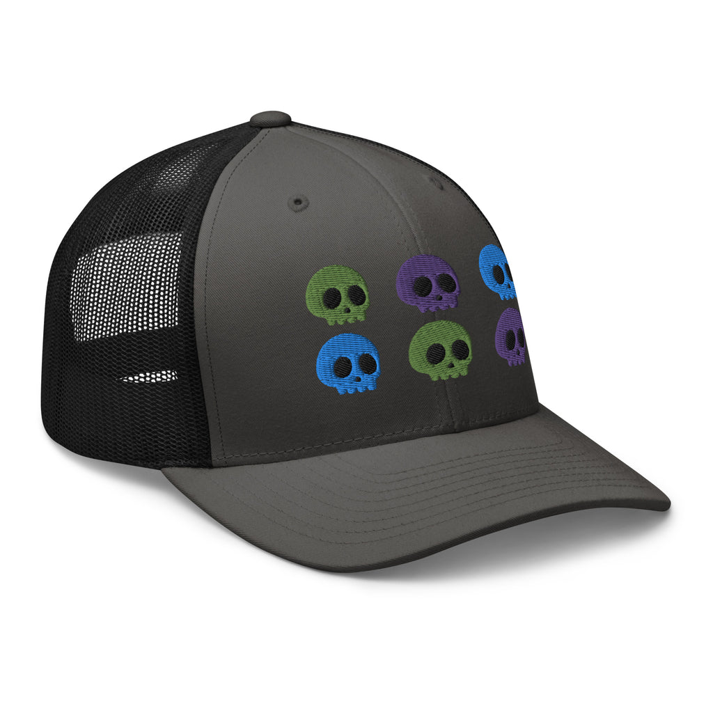 retro trucker hat charcoal grey black , with image design of 6 purple, green, and blue skulls, 2 of each color, in two rows.  side view.