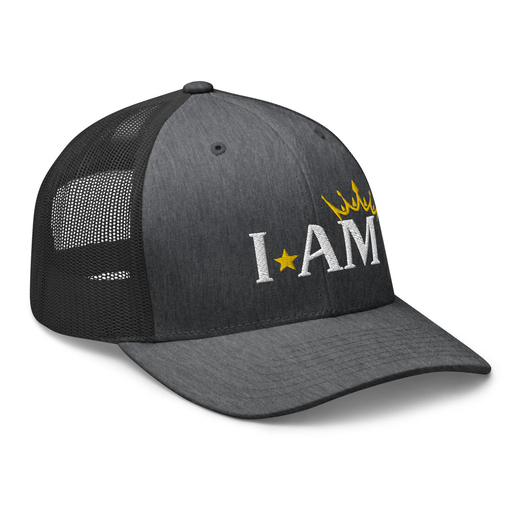retro trucker hat dark gray heather, with image phrase: "I AM," with image graphic of a gold crown over the letter M. side view.