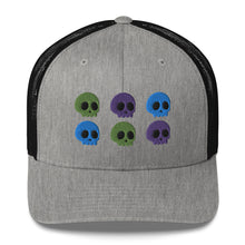 Load image into Gallery viewer, retro trucker hat heather grey black, with image design of 6 purple, green, and blue skulls, 2 of each color, in two rows.  Front view.
