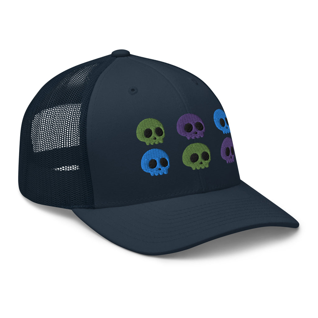 retro trucker hat navy blue, with image design of 6 purple, green, and blue skulls, 2 of each color, in two rows.  side view.