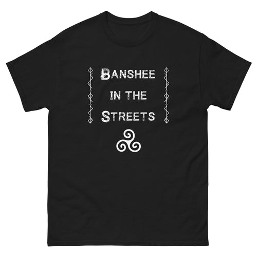 unisex black t-shirt with image phrase: Banshee in the Streets. tribal symbols on both sides. Triskele at the bottom under phrase. Front view. Halloween, spooky season.