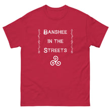 Load image into Gallery viewer, unisex red t-shirt with image phrase: Banshee in the Streets. tribal symbols on both sides. Triskele at the bottom under phrase. Front view. Halloween, spooky season.
