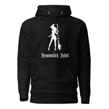 Load image into Gallery viewer, black unisex hoodie, with pockets. Image design: silhouette of a pretty witch holding a magical broom, stars. Image phrase: Broomstick rebel. Front view.
