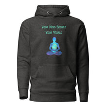 Load image into Gallery viewer, unisex charcoal grey heather hoodie with image phrase: &quot;Your mind shapes your world.&quot; With a green blue watercolor image graphic of a person&#39;s silhouette, in pose of meditation. Front view.
