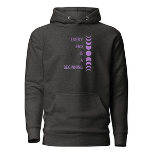 Charcoal grey heather unisex hoodie, with pockets, with image phrase: "Every end is a beginning." with image of moon phases, from new moon, to full moon, back to new moon. Front view.