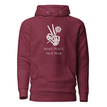 Load image into Gallery viewer, maroon unisex hoodie, with pockets, with image phrase &quot;Make peace, not war.&quot; with image graphic of a skeleton hand holding a daisy flower, and gesturing the peace sign. Front view.
