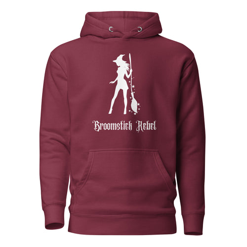 maroon unisex hoodie, with pockets. Image design: silhouette of a pretty witch holding a magical broom, stars. Image phrase: Broomstick rebel. Front view.