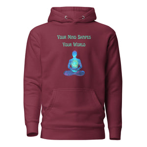 unisex maroon hoodie with image phrase: "Your mind shapes your world." With a green blue watercolor image graphic of a person's silhouette, in pose of meditation. Front view.