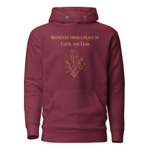 Load image into Gallery viewer, maroon unisex hoodie, with pockets, with image phrase: &quot;manifest from a place of faith, not fear.&quot; with image graphic of flowers, moon, stardust. Front view.
